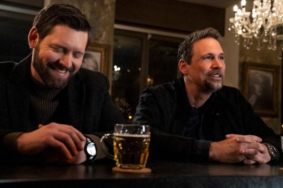 Luke Kleintank as Special Agent Scott Forrester and Jeremy Sisto as Assistant Special Agent in Charge Jubal Valentine bond over beers in the “FBI: International” episode “Remove the Compromise” (Credit: Nelly Kiss/CBS)