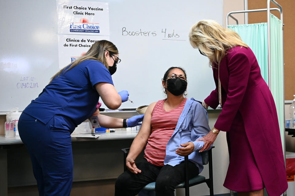 First lady Jill Biden speaks with a woman who had just gotten a COVID-19 vaccination during a visit to First Choice Community Healthcare - South Valley Medical Center in Albuquerque, N.M., Tuesday, April 21, 2021. (Mandel Ngan/Pool via AP)