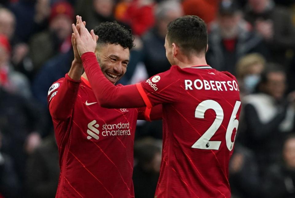 Alex Oxlade-Chamberlain (left) celebrates with Andrew Robertson after scoring in Liverpool’s 3-0 victory over Brentford on Sunday (Peter Byrne/PA) (PA Wire)
