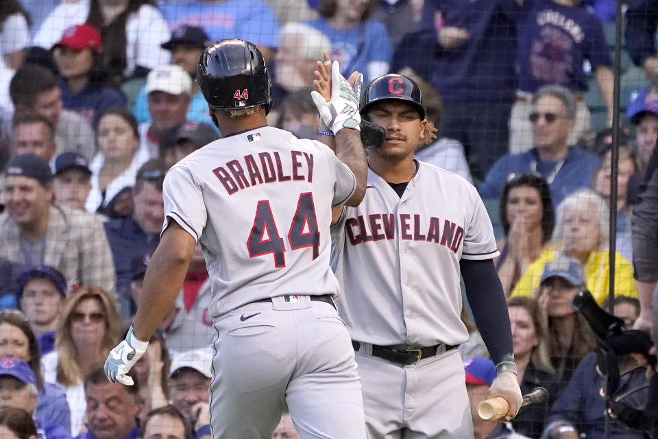 Cleveland Indians' Bobby Bradley (44) celebrates his home run off Chicago Cubs starting pitcher Albert Alzolay with Josh Naylor, right, during the second inning of a baseball game Monday, June 21, 2021, in Chicago. (AP Photo/Charles Rex Arbogast)