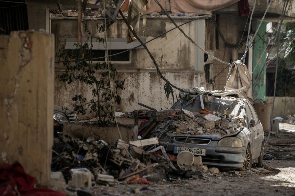 A damaged vehicle lies amidst the rubble in the aftermath of the Israeli strikes in the Chiyah area of Dahiyeh, Beirut, Lebanon (REUTERS)