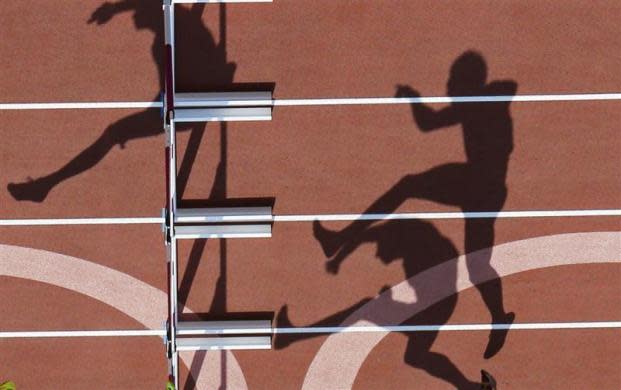 Athletes compete in the men's decathlon 110m hurdles heat at the London 2012 Olympic Games at the Olympic Stadium August 9, 2012.