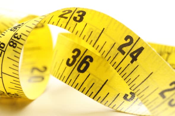 Close up of a curled tape measure.