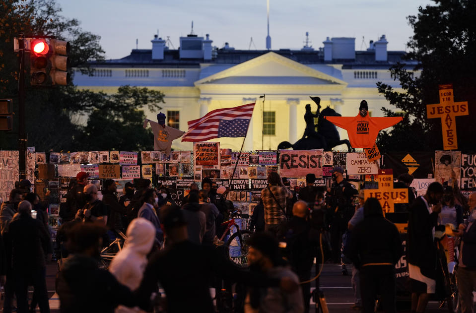 Demonstrators gather in Black Lives Matter Plaza while waiting for election results, Thursday, Nov. 5, 2020, in Washington. (AP Photo/Alex Brandon)