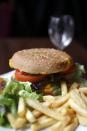 A hamburger and French fries in a restaurant in Paris