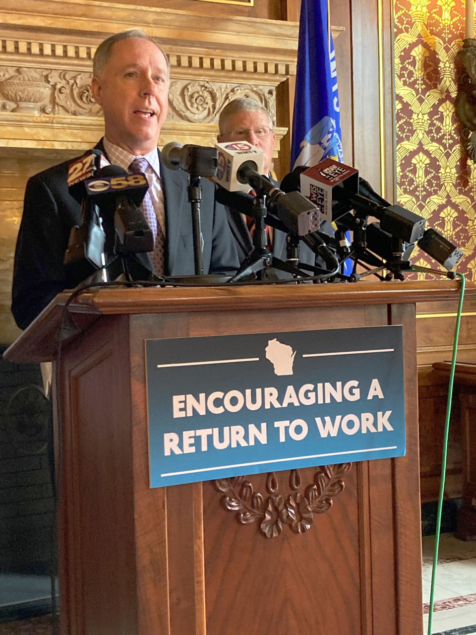 Republican Wisconsin Assembly Speaker Robin Vos describes a GOP-authored bill that would end a $300 unemployment supplemental payment as the measure's co-sponsor, Sen. Howard Marklein, listens during a Capitol news conference on Tuesday, May 18, 2021, in Madison, Wisconsin. (AP Photo/Scott Bauer)