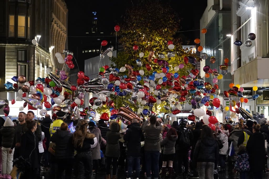 Balloons are released as people take part in a vigil in Liverpool city centre for 12-year-old Ava White (Danny LAwson/PA) (PA Wire)