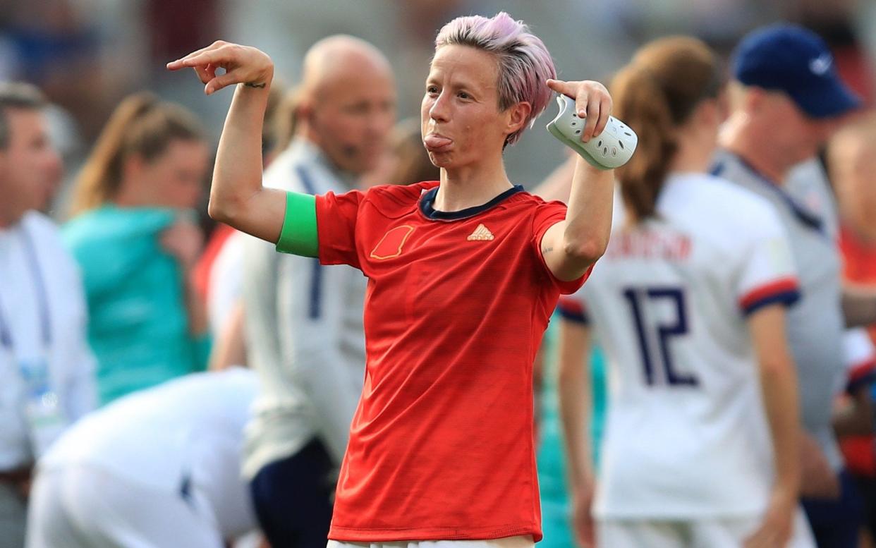 Megan Rapinoe has been criticised by Donald Trump in the past for kneeling during the national anthem - Getty Images Europe