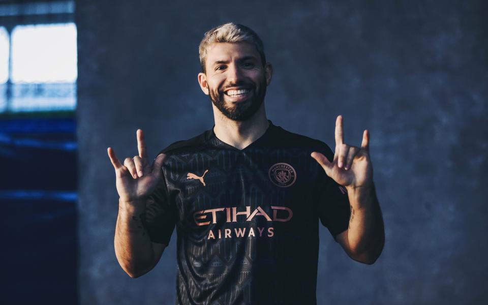 Sergio Aguero of Manchester City poses wearing the 2020/21 Puma away kit - Getty Images