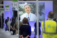 Sir Simon Stevens, CEO of the NHS, speaks via videolink as he officially opens the NHS Nightingale Hospital Birmingham, in the National Exhibition Centre (NEC), England, Thursday April 16, 2020. The NHS Nightingale Hospitals have been built to provide extra beds for patients with coronavirus symptom as the UK continues in lockdown to help curb the spread of the disease. (Jacob King/Pool Photo via AP)