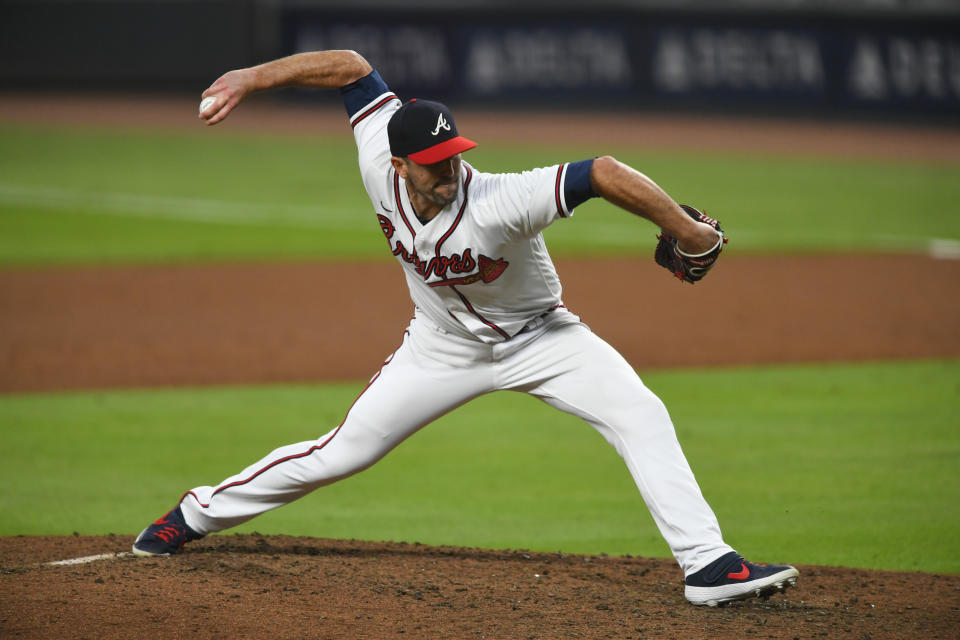 FILE - Atlanta Braves pitcher Darren O'Day works against the Miami Marlins during a baseball game in Atlanta, in this Monday, Sept. 21, 2020, file photo. The Yankees quickly found a replacement for their bullpen, agreeing to a $2.5 million, one-year contract with submarining right-hander Darren O’Day, a person familiar with the negotiations told The Associated Press on Wednesday, Jan. 27, 2021. (AP Photo/John Amis, File)