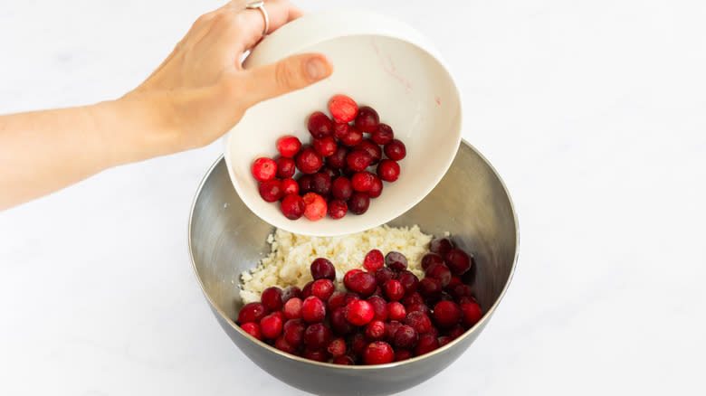 cranberries going into bowl 