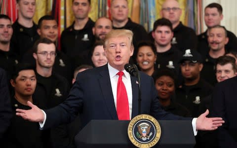 President Donald Trump at the White House today - Credit: AP