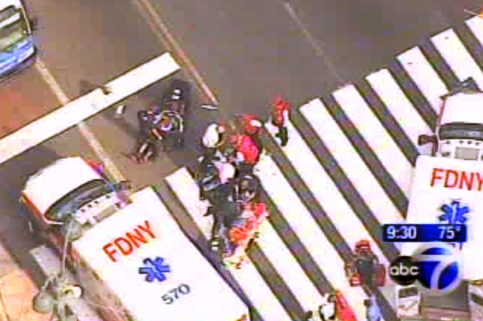 In this frame grab from WABC-TV, emergency personnel respond to reports of several people being shot outside the Empire State Building, Friday, Aug. 24, 2012, in New York. Authorities say the shooter is dead. (AP Photo/WABC-TV) MANDATORY CREDIT