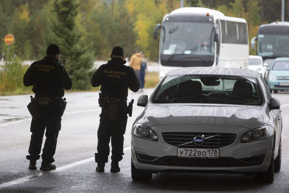 Finnish border guards on patrol, at the Vaalimaa border check point between Finland and Russia in Virolahti, Finland, Friday, Sept. 30, 2022. The Finnish-Russia border was closed Friday after the Nordic country announced it would ban Russians with tourist visas from entering, curtailing one of the last easily accessible routes to Europe for Russians trying to flee a military mobilization. Long queues were reported until midnight and among the last to enter Finland were two cyclists who arrived a little before 11 p.m., Finnish broadcaster YLE reported. (Sasu Makinen./Lehtikuva via AP)