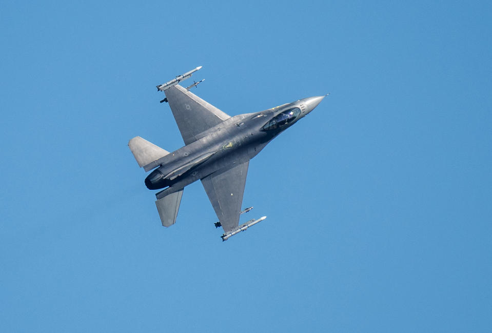 14 June 2023, Rhineland-Palatinate, Spangdahlem: An F-16 fighter aircraft flies over the U.S. Spangdahlem Air Base during the Air Defender 2023 air exercise. Twenty-five nations and NATO are taking part in the German-led air exercise until June 23. According to the Bundeswehr, around 10,000 soldiers and 250 aircraft are taking part. Photo: Harald Tittel/dpa (Photo by Harald Tittel/picture alliance via Getty Images)