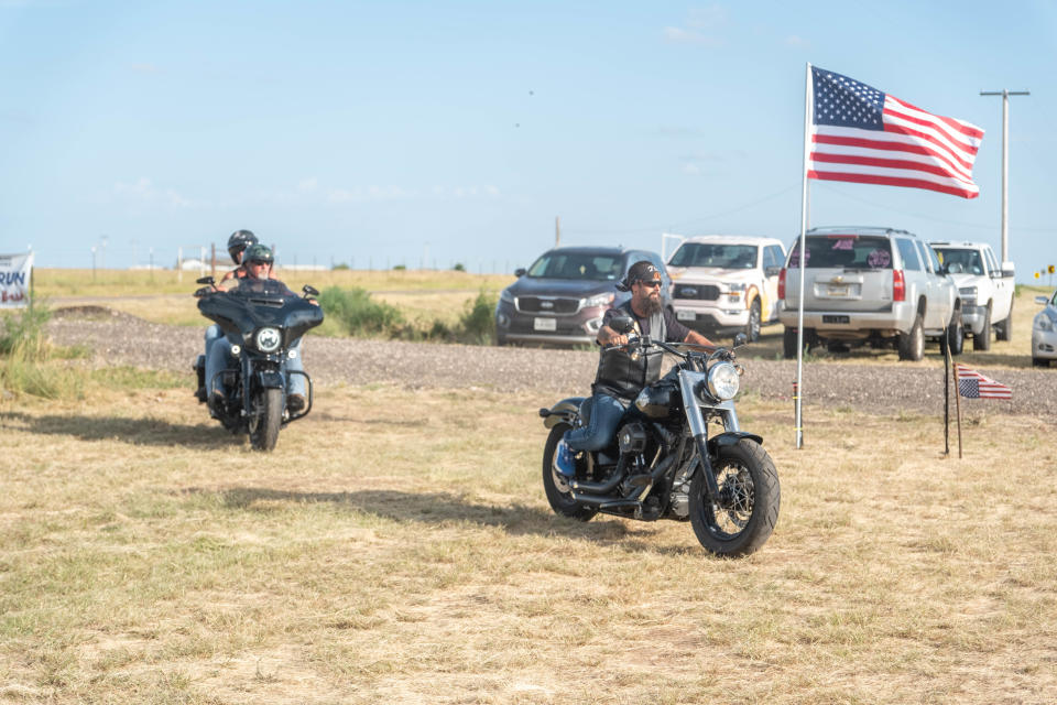 A tandem of riders complete their Bike Run Saturday during the Homeless Heroes fundraiser in Amarillo.