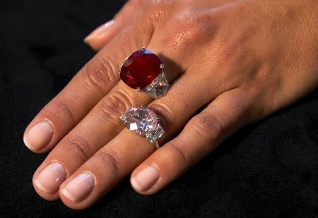 A model shows the "Sunrise Ruby" (top) and the "Historic Pink Diamond" during an auction preview at Sotheby's auction house in Geneva, Switzerland, in this May 6, 2015 file photo. REUTERS/Denis Balibouse/Files