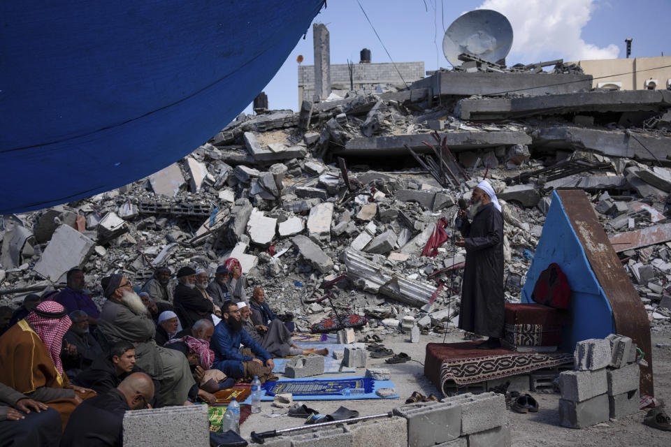 Palestinians pray in front of a mosque destroyed by the Israeli airstrikes in Rafah, Gaza Strip, Friday, March 8, 2024, ahead of the holy Islamic month of Ramadan. (AP Photo/Fatima Shbair)