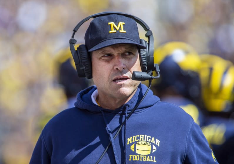 FILE - This Sept. 7, 2019, file photo, Michigan head coach Jim Harbaugh watches from the sideline.