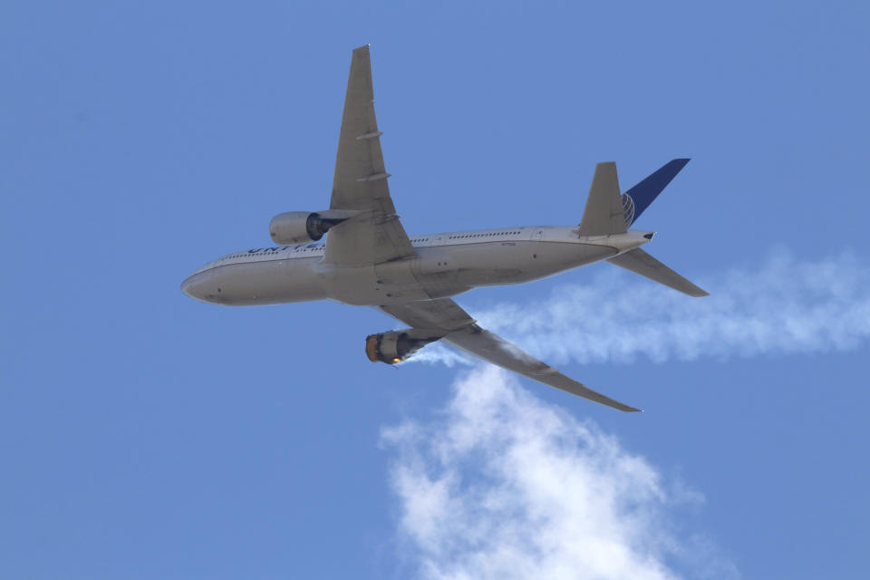 This Saturday, Feb. 20, 2021 photo provided by Hayden Smith shows United Airlines Flight 328 approaching Denver International Airport, after experiencing "a right-engine failure" shortly after takeoff from Denver. Federal regulators are investigating what caused a catastrophic engine failure on the plane that rained debris on Denver suburbs as the aircraft made an emergency landing. Authorities said nobody aboard or on the ground was hurt despite large pieces of the engine casing that narrowly missed homes below. (Hayden Smith via AP)