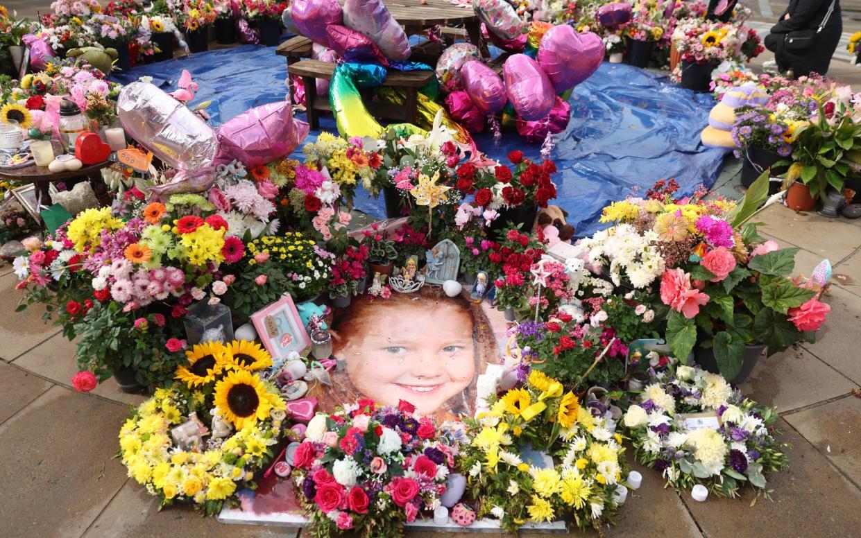 Tributes and flowers to Elsie Dot Stancombe outside the Atkinson arts centre