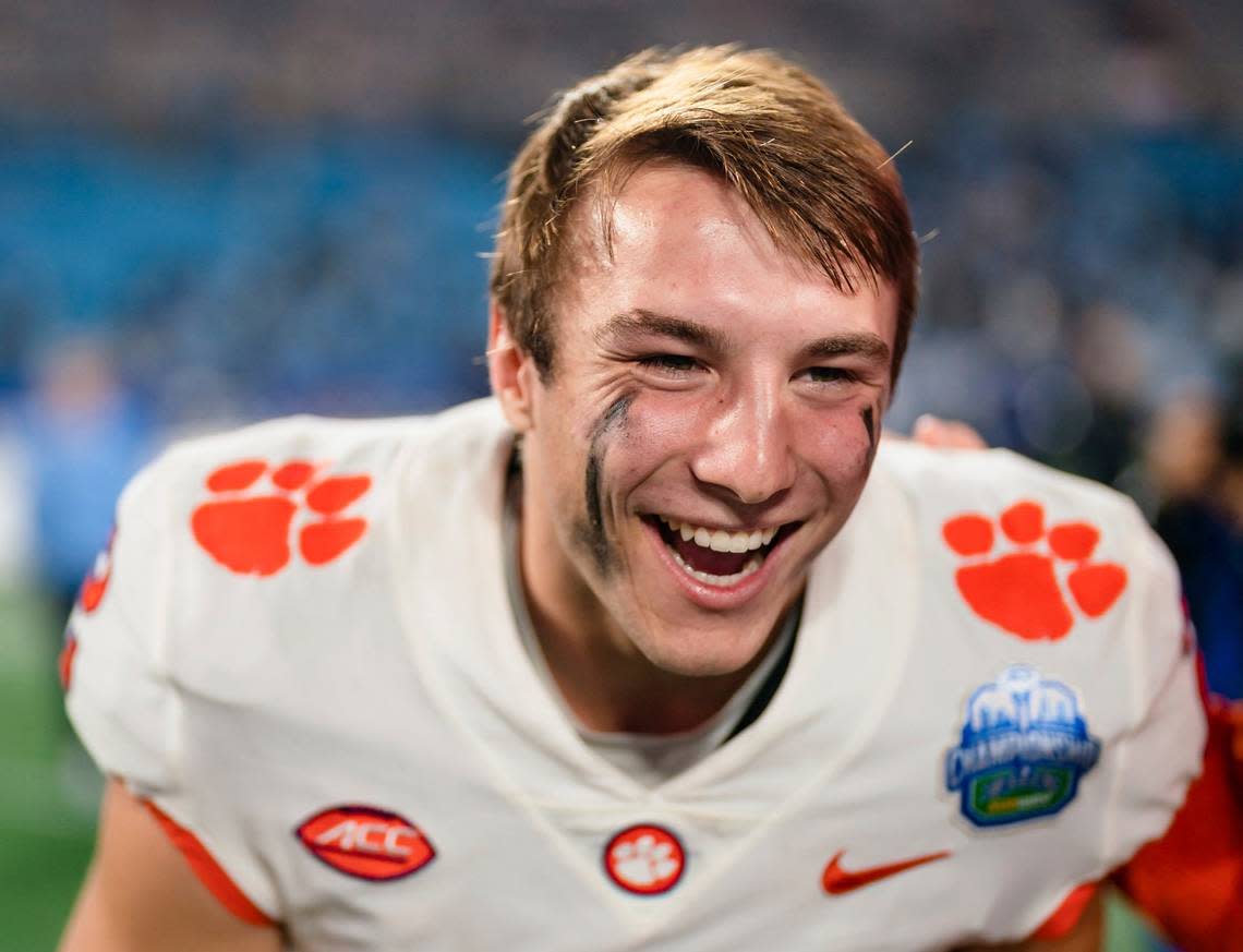 Clemson quarterback Cade Klubnik smiles after Clemson defeated North Carolina in the Atlantic Coast Conference championship NCAA college football game Saturday, Dec. 3, 2022, in Charlotte, N.C. (AP Photo/Jacob Kupferman)