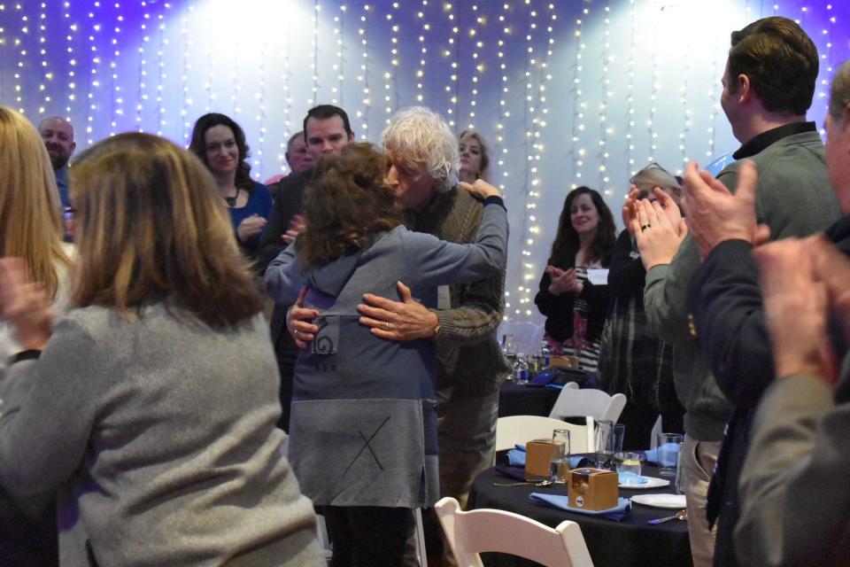 George Moses hugs his wife, Melanie, after being named Citizen of the Year. They have been married for almost 50 years.