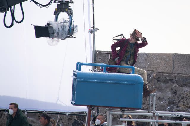 <p>Finnbarr Webster/Getty</p> Timothée Chalamet filming 'Wonka'