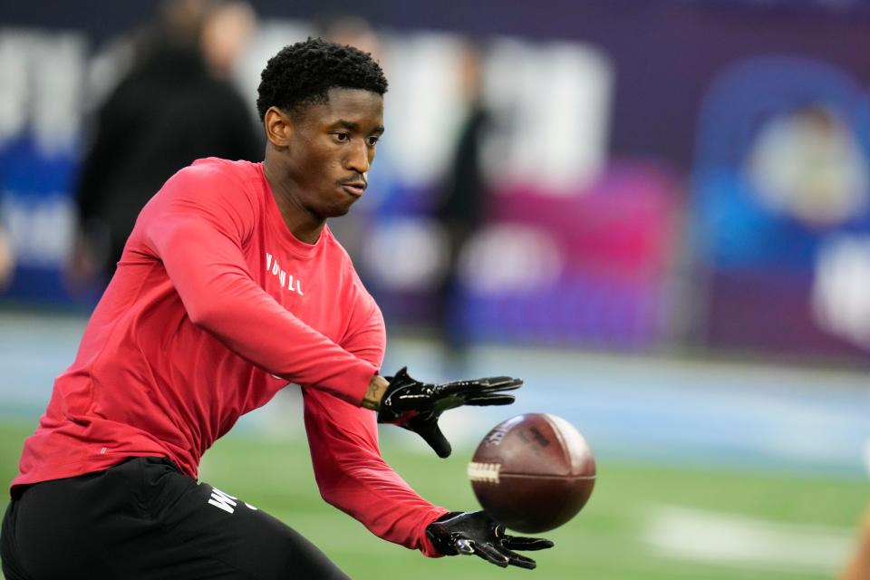 Southern California wide receiver Jordan Addison runs a drill at the NFL football scouting combine in Indianapolis, Saturday, March 4, 2023. (AP Photo/Michael Conroy)