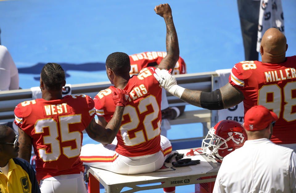 <p>Kansas City Chiefs defensive back Marcus Peters (22) protests next to running back Charcandrick West (35) and defensive tackle Roy Miller (98) during the National Anthem prior to the game against the Los Angeles Chargers at StubHub Center. (Photo: Kelvin Kuo-USA TODAY Sports) </p>