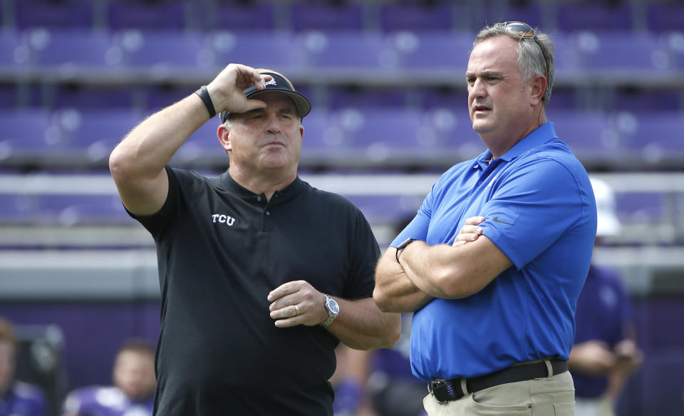 Former TCU head coach turned Texas special assistant Gary Patterson, left, goes up against his former team led by Sonny Dykes, right, in a matchup that will have College Football Playoff implications. (AP Photo/Ron Jenkins)