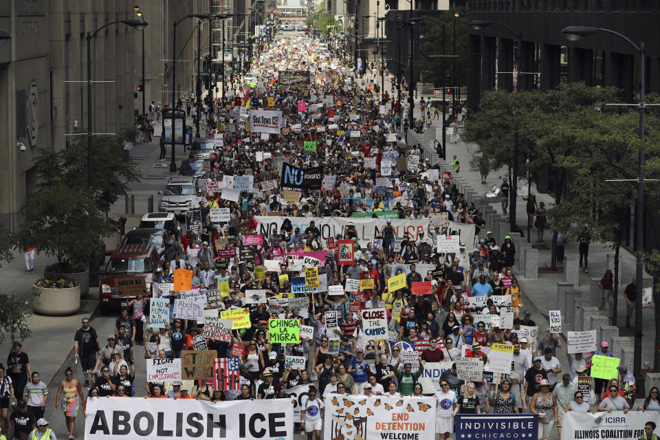 Thousands of people, including immigrants and their supporters, rally against President Trump's immigration policies as they march from Daley Plaza to the Chicago field office of Immigration and Customs Enforcement, Saturday, July 13, 2019, in Chicago. (Abel Uribe/Chicago Tribune via AP)