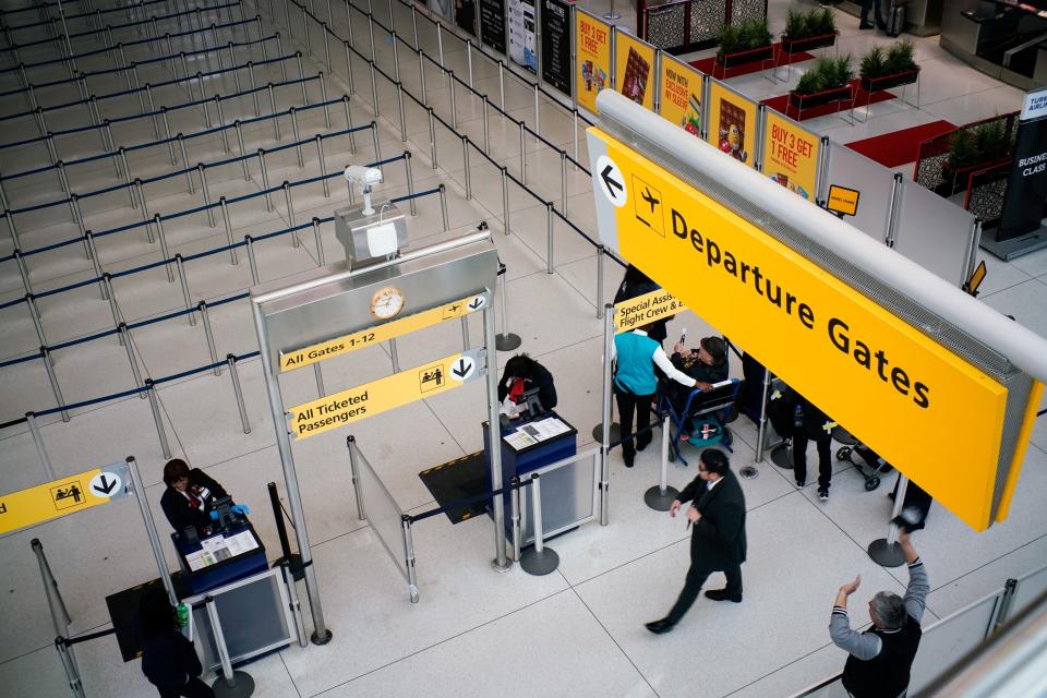 People walk to reach TSA immigration process at the John F. Kennedy International Airport in New York, U.S., March 9, 2020. REUTERS/Eduardo Munoz