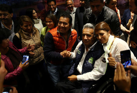 Lenin Moreno, presidential candidate of the ruling PAIS Alliance Party, is greeted by supporters after a news conference in Quito, Ecuador, February 20, 2017. REUTERS/Mariana Bazo