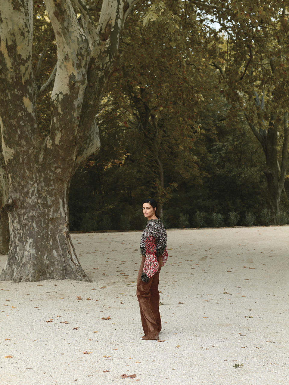 On her: Loewe wool sweater, $2,750, and suede trousers (price upon request); Dries Van Noten shoes (price upon request).