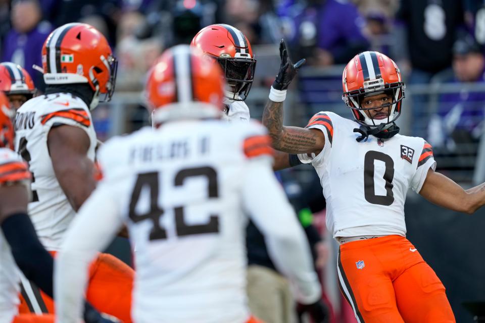 Cleveland Browns cornerback Greg Newsome II celebrates after scoring on an interception return against the Baltimore Ravens on Sunday in Baltimore.