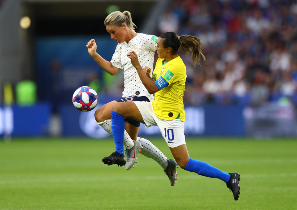 Amandine Henry of France battles for possession with Marta of Brazil during the 2019 FIFA Women's World Cup France Round Of 16 match between France and Brazil at Stade Oceane on June 23, 2019 in Le Havre, France. (Photo by Martin Rose/Getty Images)