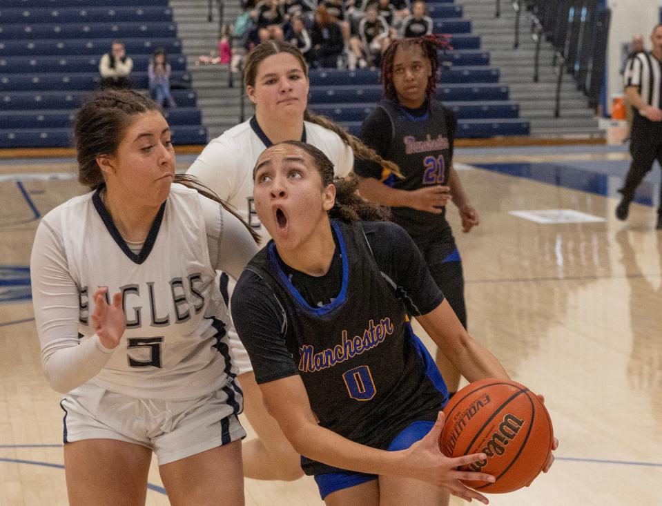 Manchester Devyn Quigley drives to the basket. Manchester Girls Basketball defeats Middletown South in 2023 WOBM Christmas Tournament opening round in Toms 
River on December 26, 2023.