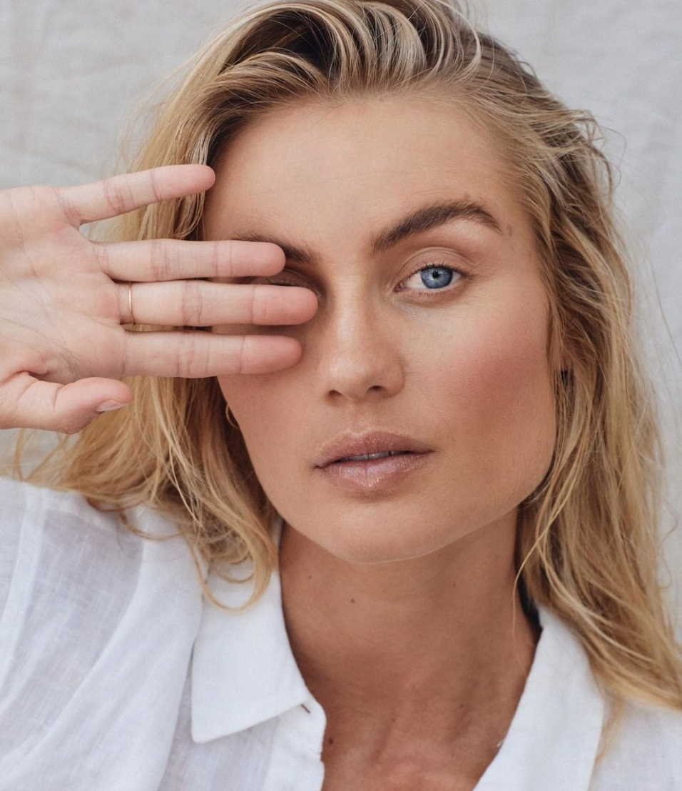 Close up of Australian model Elyse Knowles posing with one hand over her eye for beauty brand Maaemo Organics