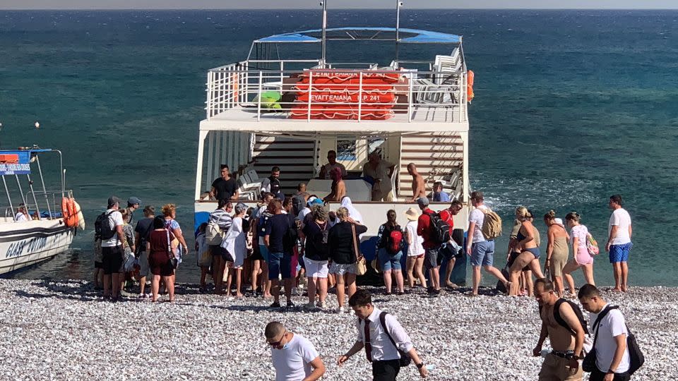 Boats were used to take some tourists to safety. - Lefteris Diamandis/Reuters