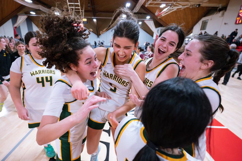 Tantasqua players celebrate after defeating Northbridge, 40-29, during the Clark Tournament Large School Final.