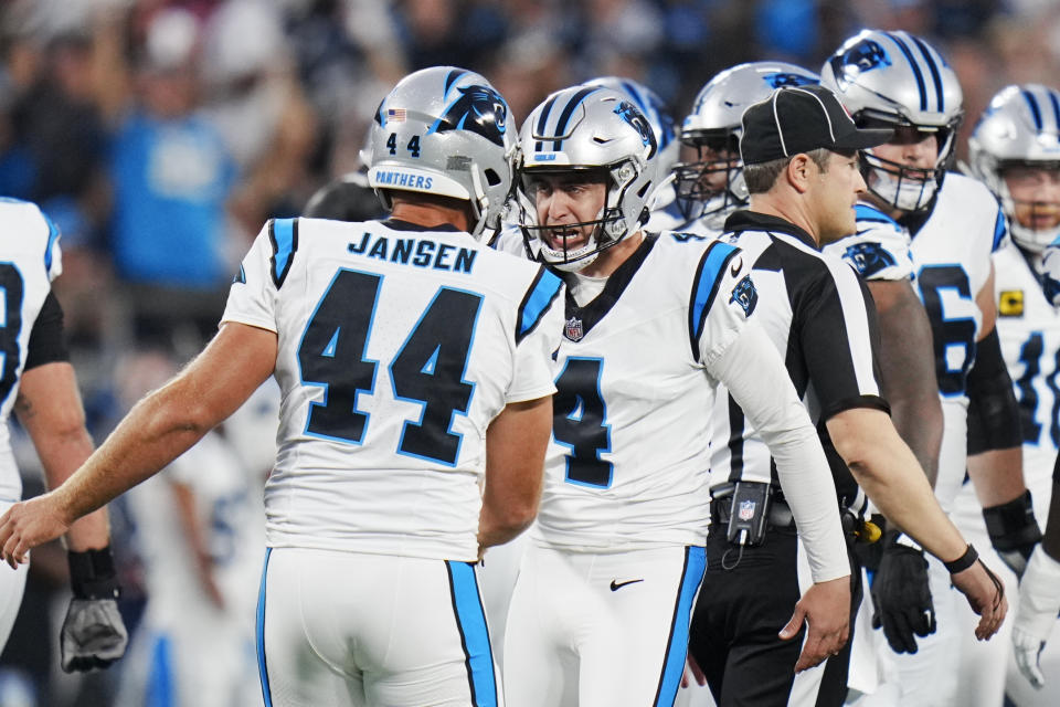Carolina Panthers place-kicker Eddy Pineiro (4) celebrates with JJ Jansen after a field goal against the New Orleans Saints during the first half of an NFL football game Monday, Sept. 18, 2023, in Charlotte, N.C. (AP Photo/Rusty Jones)