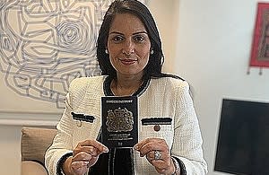 Priti Patel, the Home Secretary, holds the new passport, which is currently being issued. (Home Office website)