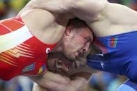 <p>Valeri Andriitsev (UKR) of Ukraine and Khetag Goziumov (AZE) of Azerbaijan compete. (Reuters) </p>