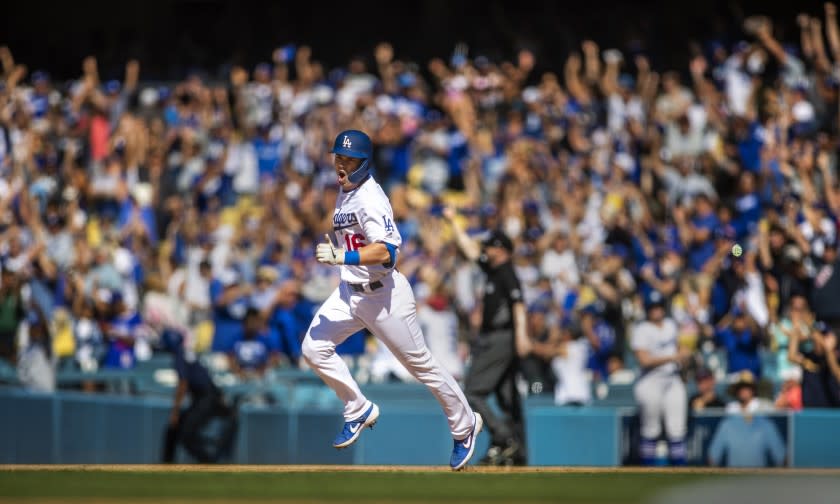 LOS ANGELES, CALIF. -- SUNDAY, JUNE 23, 2019: As the crowd cheers, Dodgers rookie Will Smith celebrates his three-run walk-off home run while rounding the bases in the bottom of the ninth inning to sweep the Rockies with three walk-offs at Dodger Stadium in Los Angeles, Calif., on June 23, 2019. Dodgers won 6-3. (Allen J. Schaben / Los Angeles Times)
