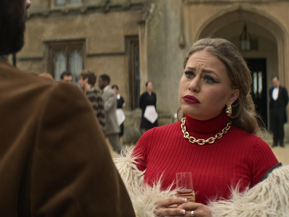 Gemma in red looking concerned - you season four