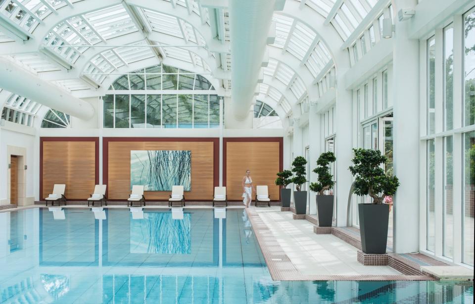 The spa within the <strong>Four Seasons Hotel Hampshire</strong> in England features a 66-foot-long indoor swimming pool that can open to the property’s outdoor pool as well.