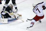 Columbus Blue Jackets' Jack Johnson (7) prepares to put the puck under the pads of Pittsburgh Penguins goalie Marc-Andre Fleury (29) for a goal during the first period of a first-round NHL playoff hockey game in Pittsburgh on Wednesday, April 16, 2014. (AP Photo/Gene J. Puskar)