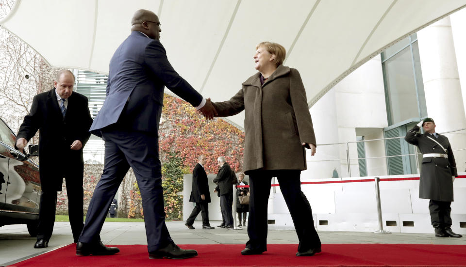 German Chancellor Angela Merkel, front right, welcomes Republic of Congo's President Felix Tshisekedi, front left, with military honors for a meeting at the chancellery in Berlin, Germany, Friday, Nov. 15, 2019. (AP Photo/Michael Sohn)